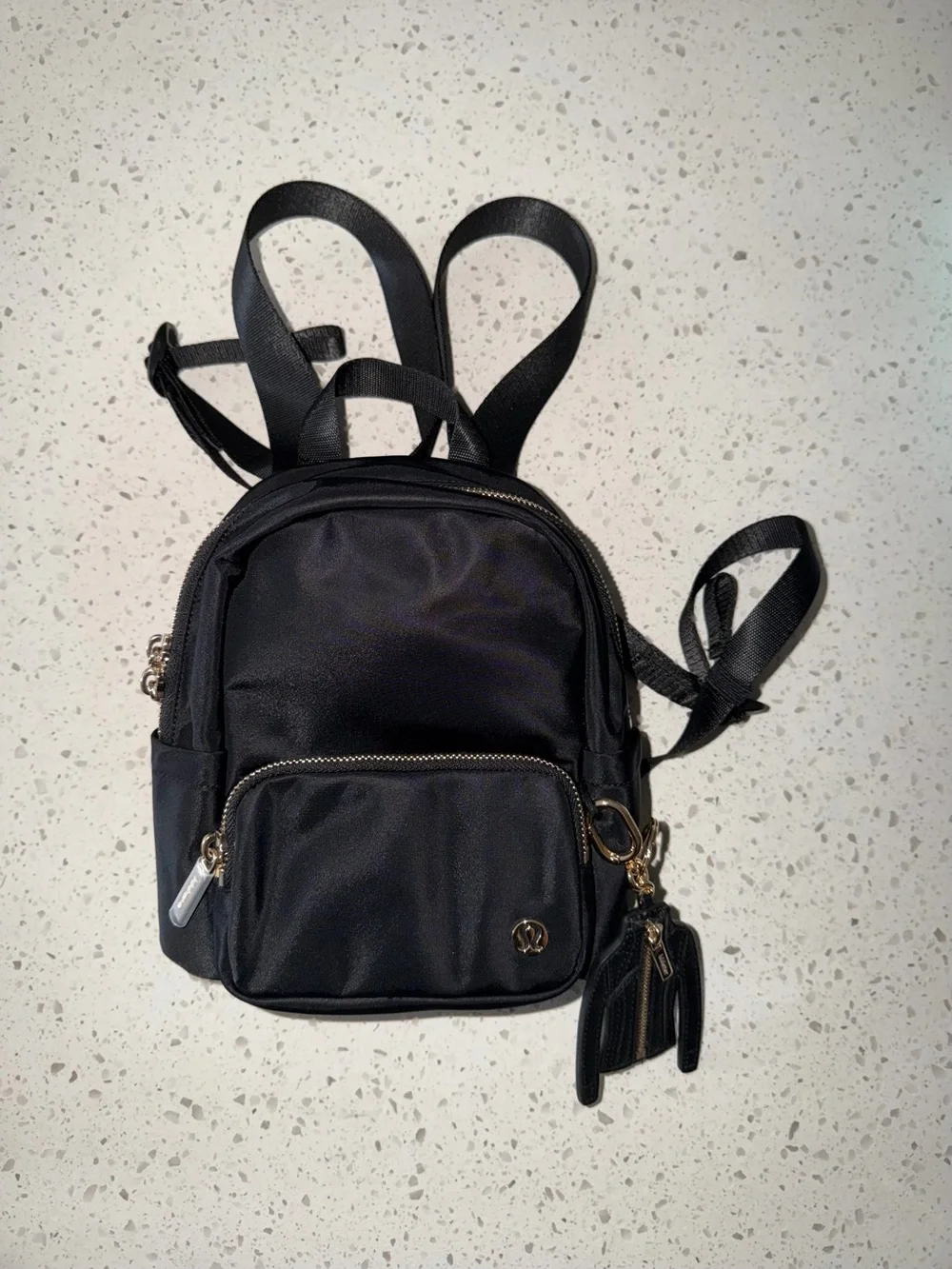 lululemon athletica Black Mini Backpack with Gold Hardware